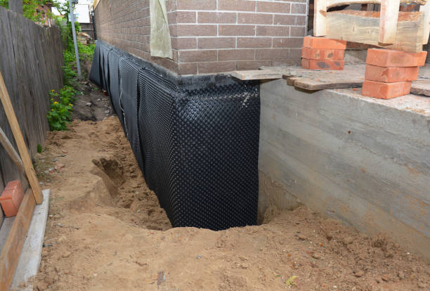 Happy homeowners after waterproofing job in Colonia